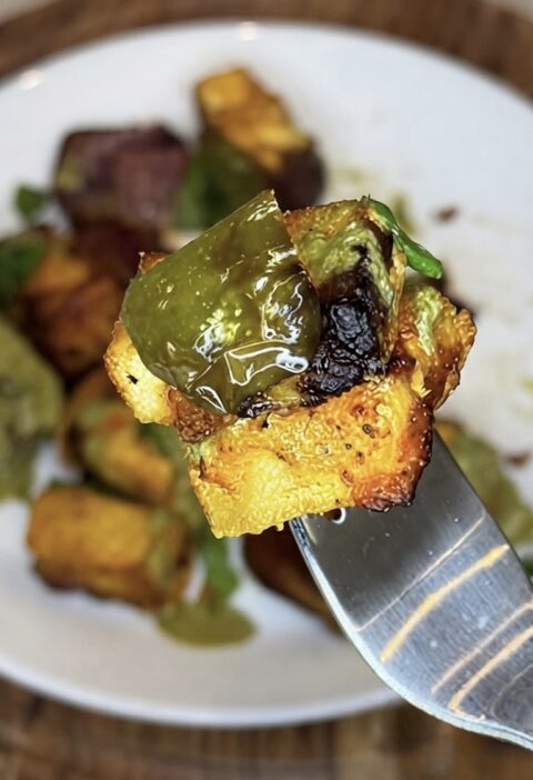 Air-fried pineapple paneer tikka skewer with charred paneer, fresh pineapple, and bell peppers.