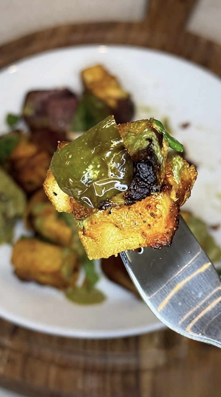 Air-fried pineapple paneer tikka skewer with charred paneer, fresh pineapple, and bell peppers.