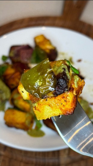 Air-fried pineapple paneer tikka skewer with charred paneer, fresh pineapple, and bell peppers.
